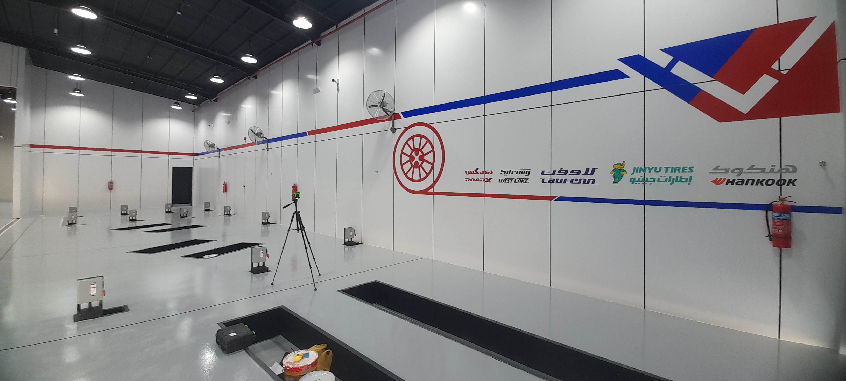 Modern office interior with large branded wall mural and motivational graphics in reception area